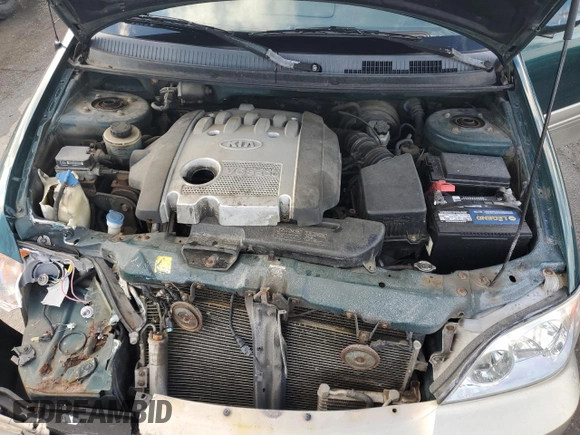 2002 Kia Sedona LX with VIN KNDUP131426217512, listed as a Copart auction lot 80928774 with 163,176 mi miles and Salvage Title. Bid and sale history available at carsss.com. Image 12.