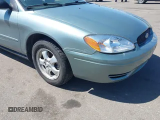 2005 Ford Taurus SE with VIN 1FAFP53U05A273576, listed as a IAAI auction lot 42140404 with 58,735 mi miles. Bid and sale history available at carsss.com. Image 6.