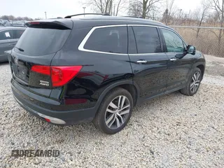 2017 Honda Pilot Touring with VIN 5FNYF6H90HB051700, listed as a IAAI auction lot 41902075 with 69,712 mi miles. Bid and sale history available at carsss.com. Image 4.