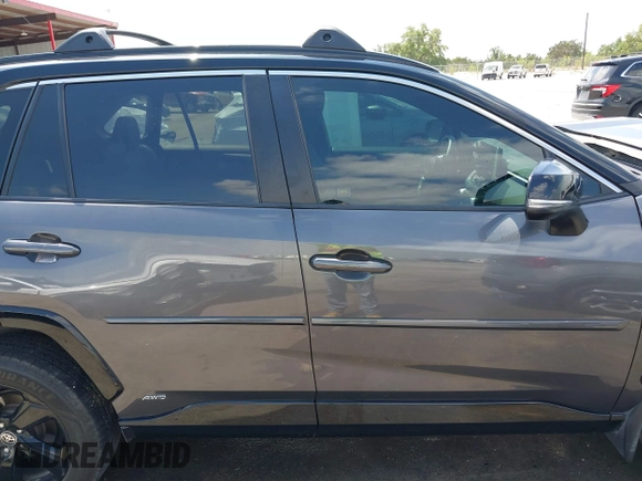 2021 Toyota RAV4 Hybrid XSE with VIN 2T3E6RFV8MW026973, listed as a IAAI auction lot 42052289 with 94,857 mi miles and . Bid and sale history available at DreamBid. Image 13.