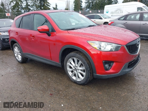 2015 Mazda CX-5 Grand Touring with VIN JM3KE4DY0F0479392, listed as a IAAI auction lot 41659415 with 141,403 mi miles. Bid and sale history available at carsss.com. Image 1.