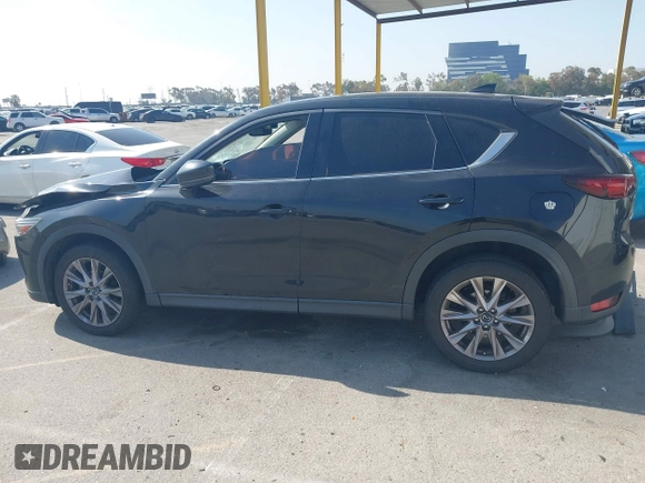 2019 Mazda CX-5 Grand Touring with VIN JM3KFADMXK1547727, listed as a IAAI auction lot 42138071 with Not provided miles and . Bid and sale history available at DreamBid. Image 14.