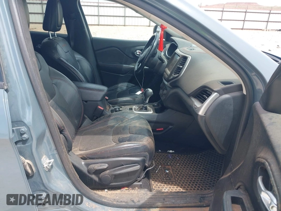 2015 Jeep Cherokee Trailhawk with VIN 1C4PJMBS0FW524479, listed as a IAAI auction lot 41908871 with 118,825 mi miles and . Bid and sale history available at DreamBid. Image 5.
