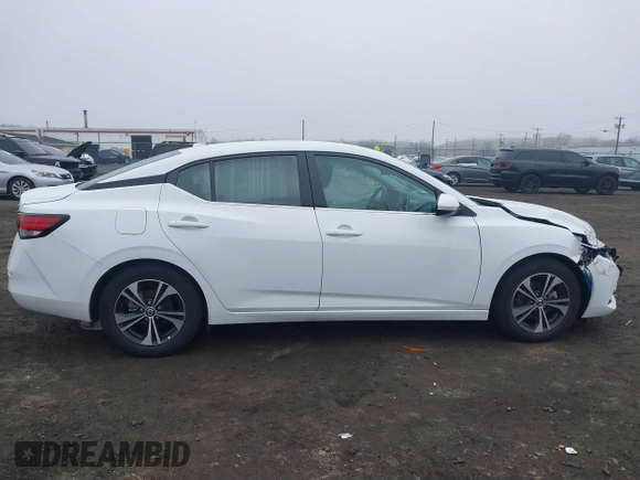 2022 Nissan Sentra SV z VIN 3N1AB8CV3NY307506, wystawiony jako IAAI lot #41830376 z przebiegiem 6 899 mil mil oraz . Historia ofert i sprzedaży dostępna na DreamBid. Obrazek 13.
