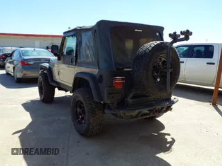 2005 Jeep Wrangler Sport with VIN 1J4FA49S45P345673, listed as a IAAI auction lot 41830128 with 139,432 mi miles. Bid and sale history available at carsss.com. Image 3.