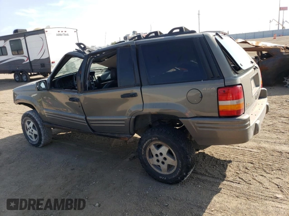 1998 Jeep Grand Cherokee Limited with VIN 1J4GZ78Y2WC146974, listed as a Copart auction lot 71435484 with 192,996 mi miles and Salvage Title. Bid and sale history available at carsss.com. Image 2.