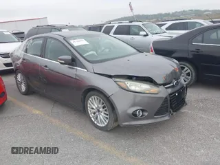 2014 Ford Focus Titanium with VIN 1FADP3J20EL236805, listed as a IAAI auction lot 41708437 with 105,724 mi miles. Bid and sale history available at carsss.com. Image 1.