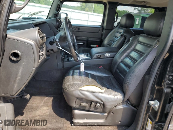 2006 Hummer H2 with VIN 5GRGN23U26H100264, listed as a Copart auction lot 58083494 with 169,104 mi miles and Salvage Title. Bid and sale history available at carsss.com. Image 7.