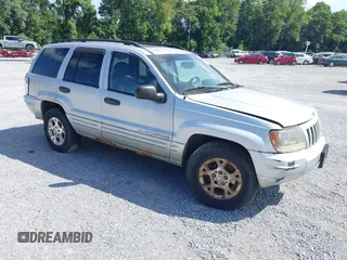 2004 Jeep Grand Cherokee Laredo z VIN 1J4GW48NX4C411845, wystawiony jako IAAI lot #42839244 z przebiegiem 193 790 mil mil oraz . Historia ofert i sprzedaży dostępna na DreamBid. Obrazek 1.