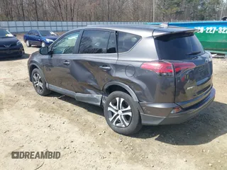2017 Toyota RAV4 LE with VIN 2T3ZFREV9HW390859, listed as a IAAI auction lot 41802727 with 167,085 mi miles and . Bid and sale history available at carsss.com. Image 3.