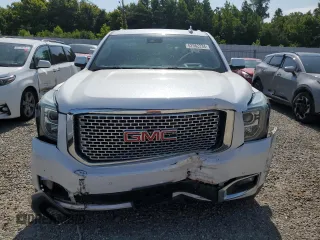 2016 GMC Yukon Denali with VIN 1GKS1CKJ7GR264548, listed as a Copart auction lot 62982234 with 105,724 mi miles and Salvage Title. Bid and sale history available at carsss.com. Image 5.