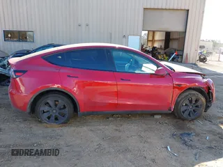2023 Tesla Model Y Long Range with VIN 7SAYGDEE8PF709459, listed as a IAAI auction lot 41334108 with 51,544 mi miles. Bid and sale history available at carsss.com. Image 12.
