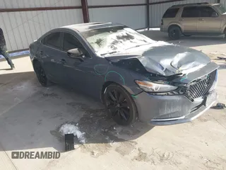 2021 Mazda 6 Carbon Edition with VIN JM1GL1WY6M1616617, listed as a IAAI auction lot 41365615 with 60,747 mi miles and . Bid and sale history available at DreamBid. Image 1.