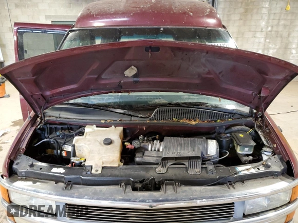 2002 Chevrolet Express z VIN 1GBFG15R921215686, wystawiony jako Copart lot #75614424 z przebiegiem Nie podano mil oraz Szkody całkowita. Historia ofert i sprzedaży dostępna na DreamBid. Obrazek 12.