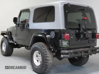 2005 Jeep Wrangler Unlimited with VIN 1J4FA44S75P305935, listed as a Copart auction lot 65582205 with 116,569 mi miles and Salvage title. Bid and sale history available at DreamBid. Image 4.