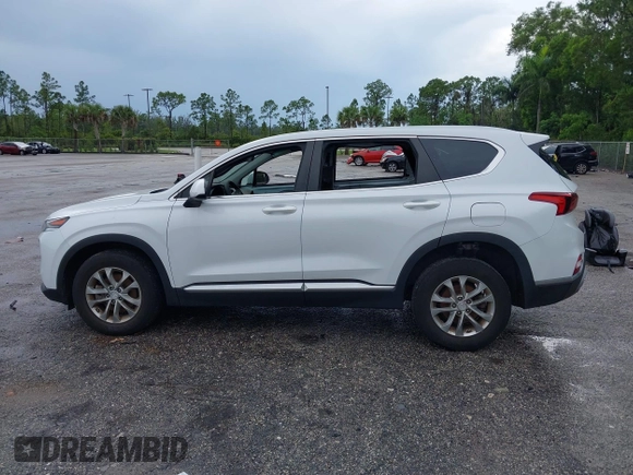 2019 Hyundai Santa Fe SE with VIN 5NMS23ADXKH038506, listed as a IAAI auction lot 42407399 with 54,540 mi miles and . Bid and sale history available at DreamBid. Image 15.