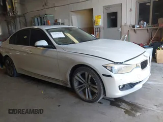 2015 BMW 3 Series 328i xDrive with VIN WBA3B3C54FJ985032, listed as a IAAI auction lot 41294225 with 100,530 mi miles. Bid and sale history available at carsss.com. Image 1.