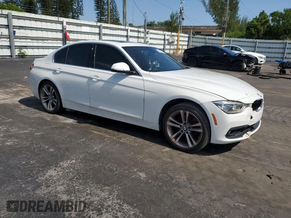 2018 BMW 3 Series 330i with VIN WBA8B9C58JEE80964, listed as a Copart auction lot 57103285 with 188,488 mi miles and Salvage title. Bid and sale history available at DreamBid. Image 4.