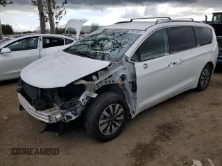 2021 Chrysler Pacifica Hybrid Touring L with VIN 2C4RC1L7XMR585887, listed as a Copart auction lot 50979835 with 85,749 mi miles and Salvage title. Bid and sale history available at DreamBid. Image 1.