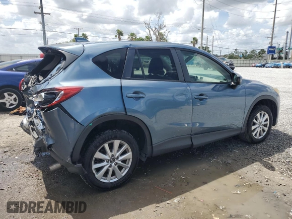 2014 Mazda CX-5 Touring with VIN JM3KE4CYXE0409558, listed as a Copart auction lot 51762995 with 91,082 mi miles and Salvage Title. Bid and sale history available at carsss.com. Image 3.