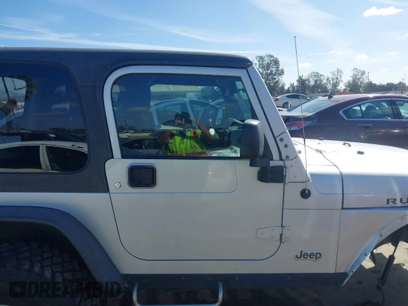 2004 Jeep Wrangler Rubicon with VIN 1J4FA69S94P701660, listed as a IAAI auction lot 41699554 with 74,640 mi miles. Bid and sale history available at carsss.com. Image 14.