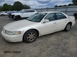 2002 Cadillac Seville Luxury SLS z VIN 1G6KS54Y42U263557, wystawiony jako Copart lot #76303424 z przebiegiem 164 707 mil mil oraz Szkoda całkowita • Salvage title. Historia ofert i sprzedaży dostępna na DreamBid. Obrazek 1.