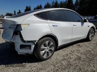 2023 Tesla Model Y Long Range z VIN 7SAYGDEE7PF788932, wystawiony jako Copart lot #52822515 z przebiegiem 33 007 mil mil oraz Szkoda całkowita • Salvage title. Historia ofert i sprzedaży dostępna na DreamBid. Obrazek 3.