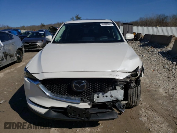 2021 Mazda CX-5 Grand Touring with VIN JM3KFBDM9M1426809, listed as a Copart auction lot 48468345 with 74,500 mi miles and Salvage Title. Bid and sale history available at carsss.com. Image 5.