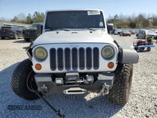 2010 Jeep Wrangler Unlimited Rubicon with VIN 1J4BA6H12AL107485, listed as a Copart auction lot 48802825 with 123,299 mi miles and Salvage title. Bid and sale history available at DreamBid. Image 5.