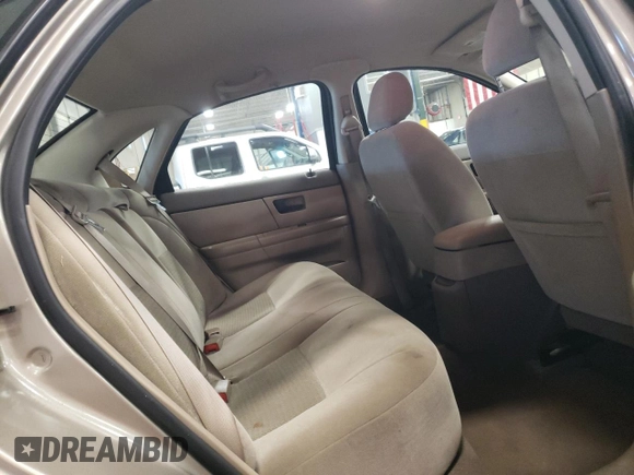 2005 Ford Taurus SE with VIN 1FAFP53U15A276082, listed as a Copart auction lot 52015285 with 103,479 mi miles and Salvage Title. Bid and sale history available at carsss.com. Image 10.