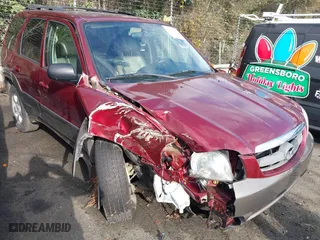 2003 Mazda Tribute ES with VIN 4F2CZ06153KM56524, listed as a IAAI auction lot 41104529 with 127,457 mi miles. Bid and sale history available at carsss.com. Image 1.