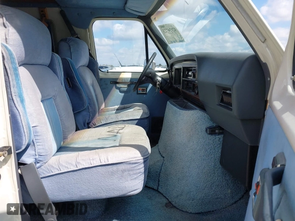 1991 Ford Econoline Cargo with VIN 1FDGS24H5MHB29665, listed as a IAAI auction lot 42136723 with 94,232 mi miles and . Bid and sale history available at DreamBid. Image 5.