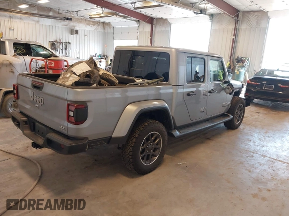 2021 Jeep Gladiator High Altitude with VIN 1C6HJTFG1ML556741, listed as a IAAI auction lot 42240680 with 47,926 mi miles and . Bid and sale history available at DreamBid. Image 4.