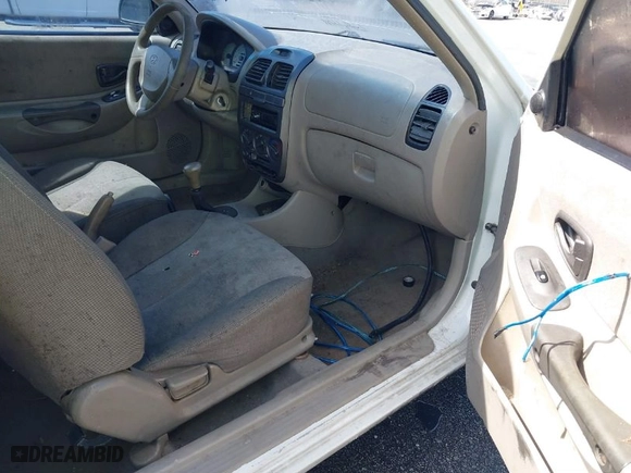2002 Hyundai Accent GL with VIN KMHCG35C32U213819, listed as a IAAI auction lot 41834267 with 167,798 mi miles. Bid and sale history available at carsss.com. Image 5.