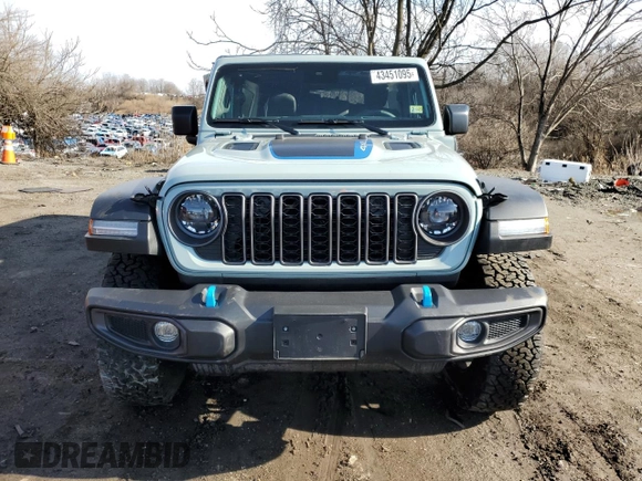 2024 Jeep Wrangler Rubicon with VIN 1C4RJXR61RW255979, listed as a Copart auction lot 43451095 with 7,258 mi miles and Salvage title. Bid and sale history available at DreamBid. Image 5.