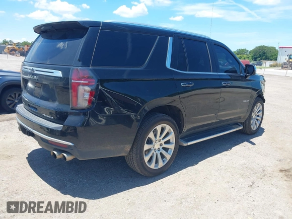 2021 Chevrolet Tahoe Premier with VIN 1GNSKSKDXMR195984, listed as a IAAI auction lot 42528305 with 89,925 mi miles and . Bid and sale history available at DreamBid. Image 4.