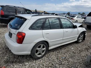2002 Mazda Protege z VIN JM1BJ245721470434, wystawiony jako Copart lot #57293765 z przebiegiem 144 622 mil mil oraz Szkoda całkowita • Salvage title. Historia ofert i sprzedaży dostępna na DreamBid. Obrazek 3.