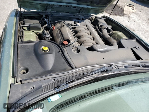 1999 Jaguar XJ with VIN SAJHX604XXC854217, listed as a Copart auction lot 56042735 with 127,092 mi miles and Salvage title. Bid and sale history available at DreamBid. Image 11.