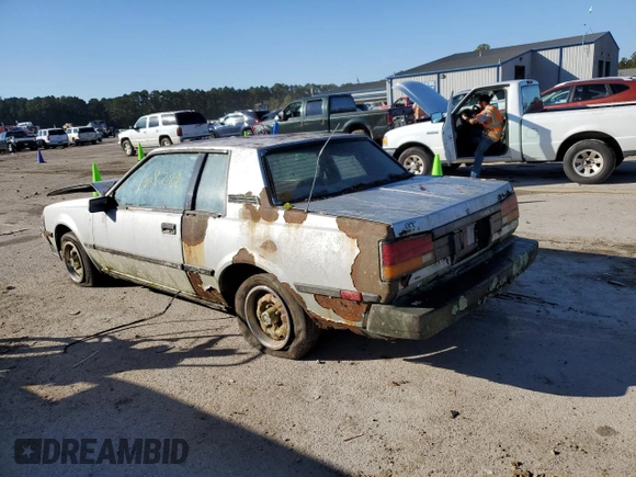 1984 Toyota Celica z VIN JT2RA64C7E6218560, wystawiony jako Copart lot #63087872 z przebiegiem 168 288 mil mil oraz Czysty tytuł • Clean title. Historia ofert i sprzedaży dostępna na DreamBid. Obrazek 3.