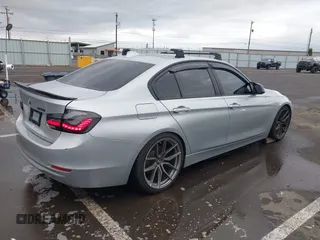 2014 BMW 3 Series 328i with VIN WBA3C1C58EK105766, listed as a IAAI auction lot 41692037 with 156,038 mi miles. Bid and sale history available at carsss.com. Image 4.