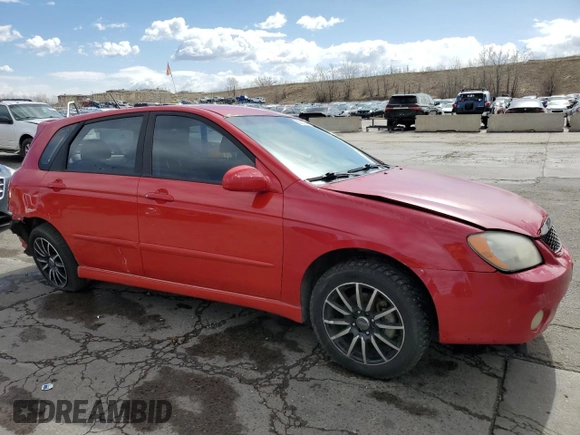 2005 Kia Spectra with VIN KNAFE161455072263, listed as a Copart auction lot 50353204 with 179,957 mi miles and Salvage Title. Bid and sale history available at DreamBid. Image 4.