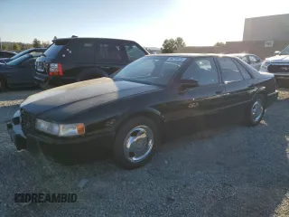 1992 Cadillac Seville z VIN 1G6KY53B3NU810317, wystawiony jako Copart lot #46216475 z przebiegiem 112 679 mil mil oraz Tytuł czysty. Historia ofert i sprzedaży dostępna na DreamBid. Obrazek 1.