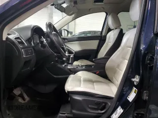 2016 Mazda CX-5 Grand Touring with VIN JM3KE4DY0G0826687, listed as a Copart auction lot 50886975 with 130,493 mi miles and Salvage Title. Bid and sale history available at carsss.com. Image 7.