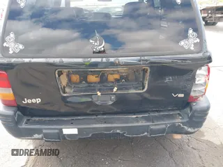 1996 Jeep Grand Cherokee Limited z VIN 1J4GZ78Y3TC191000, wystawiony jako IAAI lot #42259621 z przebiegiem 212 690 mil mil oraz . Historia ofert i sprzedaży dostępna na DreamBid. Obrazek 6.