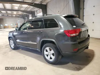 2011 Jeep Grand Cherokee Laredo with VIN 1J4RS4GG9BC517059, listed as a Copart auction lot 52704705 with 120,171 mi miles and Salvage Title. Bid and sale history available at DreamBid. Image 2.