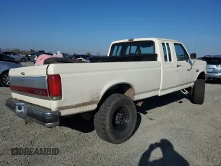 1991 Ford F-250 with VIN 1FTHX26M1MKA14231, listed as a Copart auction lot 41796005 with 6,983 mi miles and Salvage Title. Bid and sale history available at carsss.com. Image 3.