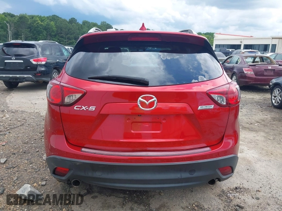 2016 Mazda CX-5 Grand Touring z VIN JM3KE2DY6G0693678, wystawiony jako IAAI lot #42443247 z przebiegiem 127 620 mil mil oraz . Historia ofert i sprzedaży dostępna na DreamBid. Obrazek 16.