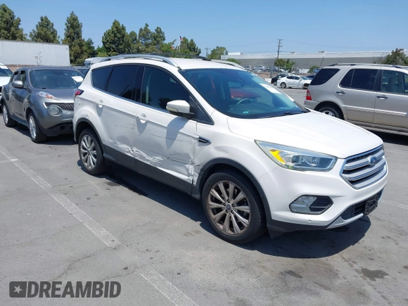 2018 Ford Escape Titanium with VIN 1FMCU0J94JUB26110, listed as a IAAI auction lot 42436285 with 59,586 mi miles and . Bid and sale history available at DreamBid. Image 1.