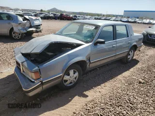 1991 Dodge Dynasty LE z VIN 1B3XC56R9MD115785, wystawiony jako Copart lot #48073715 z przebiegiem 64 483 mil mil oraz Szkoda całkowita • Salvage title. Historia ofert i sprzedaży dostępna na DreamBid. Obrazek 1.