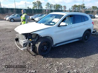 2018 BMW X1 xDrive28i with VIN WBXHT3C34J5L29714, listed as a IAAI auction lot 41825126 with 89,970 mi miles. Bid and sale history available at carsss.com. Image 2.